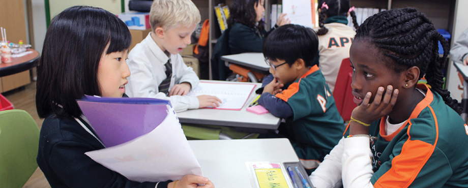 APIS elementary students developing literacy skills in Readers and Writers Workshop